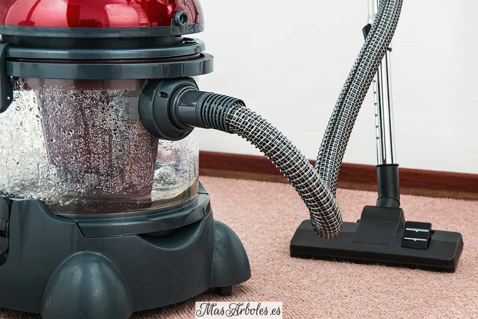 Black and Red Canister Vacuum Cleaner on Floor